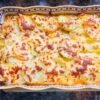 Baked Raclette with Potatoes and Charcuterie
