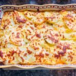 Baked Raclette with Potatoes and Charcuterie