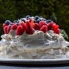 Classic Australian Pavlova with Whipped Cream and Berries
