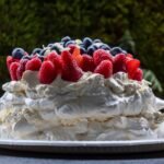 Classic Australian Pavlova with Whipped Cream and Berries