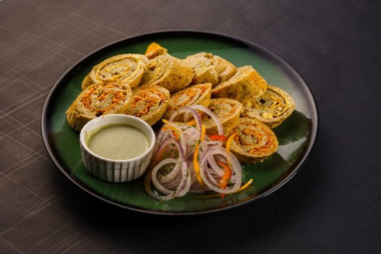 Gujarati Rolled Chickpea Flour Snack with Mustard Tempering