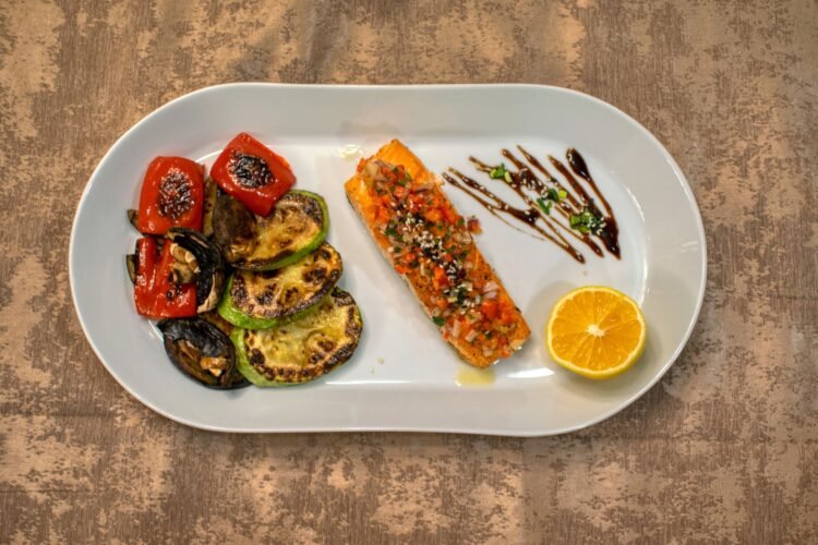 Harissa-Honey Glazed Salmon with Pearl Couscous and Charred Lemon