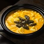 Ivorian Pasta Soup with Smoked Fish and Greens