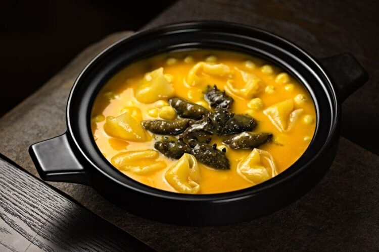 Ivorian Pasta Soup with Smoked Fish and Greens
