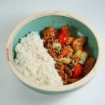 Korean Gochujang-Glazed Chicken Thighs with Sesame Rice, Charred Bok Choy, and Quick-Pickled Daikon