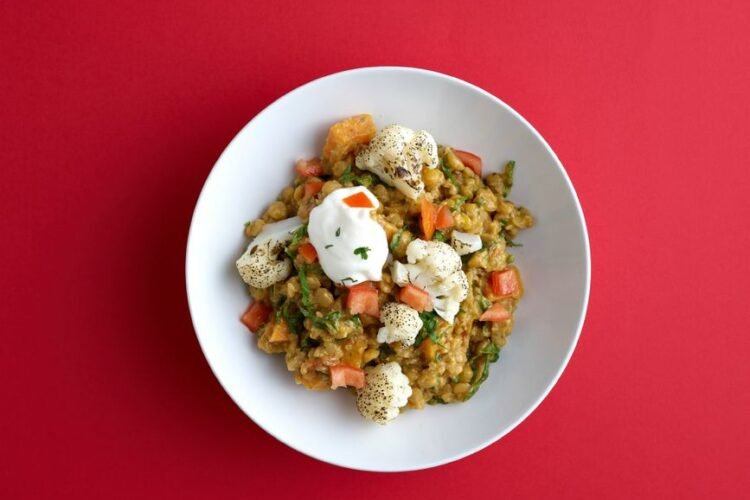Lebanese-Style Freekeh Bowl with Harissa Cauliflower, Whipped Feta, and Pomegranate