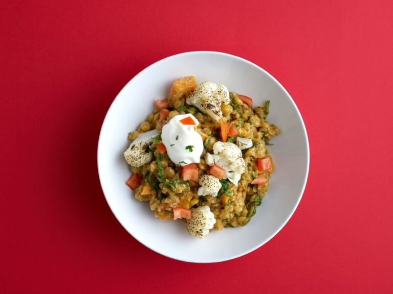 Lebanese-Style Freekeh Bowl with Harissa Cauliflower, Whipped Feta, and Pomegranate