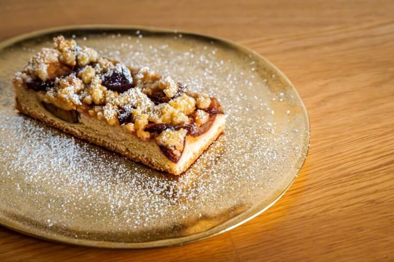 Olive Oil Cake with Roasted Plums, Amaretti Crumble, and Mascarpone Cream