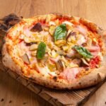 Roman-Style Pizza with Ham, Mushrooms, Artichokes, Olives, and Egg