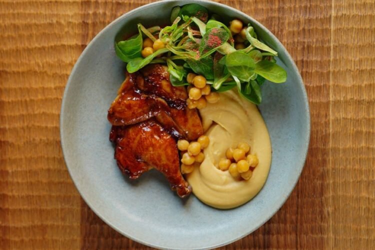 Sheet-Pan Honey-Sriracha Chicken Thighs with Charred Broccolini and Crispy Chickpeas