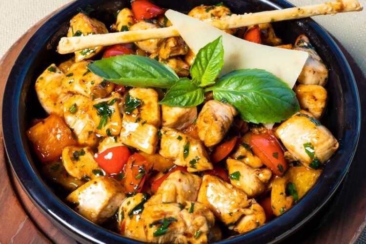 Sicilian-Style Grilled Chicken and Farro Bowl with Sun-Dried Tomato Pesto and Charred Eggplant