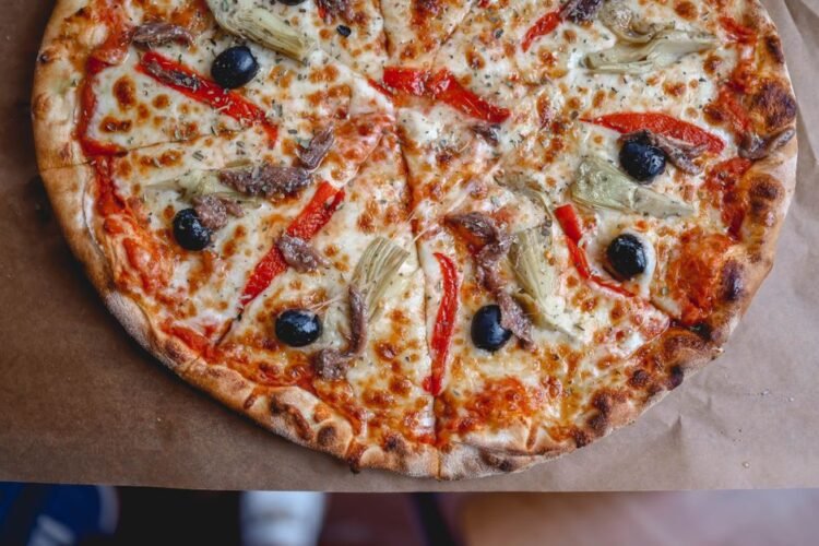 Sicilian-Style Thick Pizza with Tomato, Onions, and Anchovies