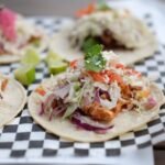 Smoky Chicken Tinga Tacos with Charred Corn-Poblano Slaw and Crispy Cheese Skirt