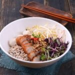 Thai Crispy Pork Belly Noodle Bowl with Coconut Lime Broth