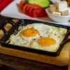 Tunisian Baked Eggs with Sweet Peppers and Harissa