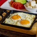 Tunisian Baked Eggs with Sweet Peppers and Harissa