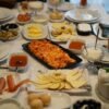 Turkish Breakfast Spread with Spiced Sausage and Tomato Scrambled Eggs