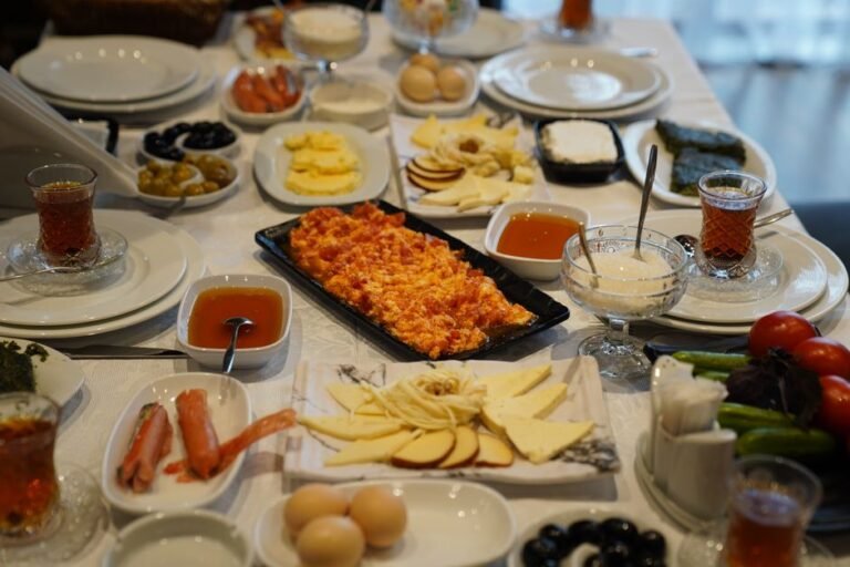 Turkish Breakfast Spread with Spiced Sausage and Tomato Scrambled Eggs