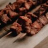 Ugandan Char-Grilled Pork Skewers with Kachumbari and Cassava Fries