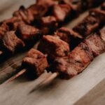 Ugandan Char-Grilled Pork Skewers with Kachumbari and Cassava Fries