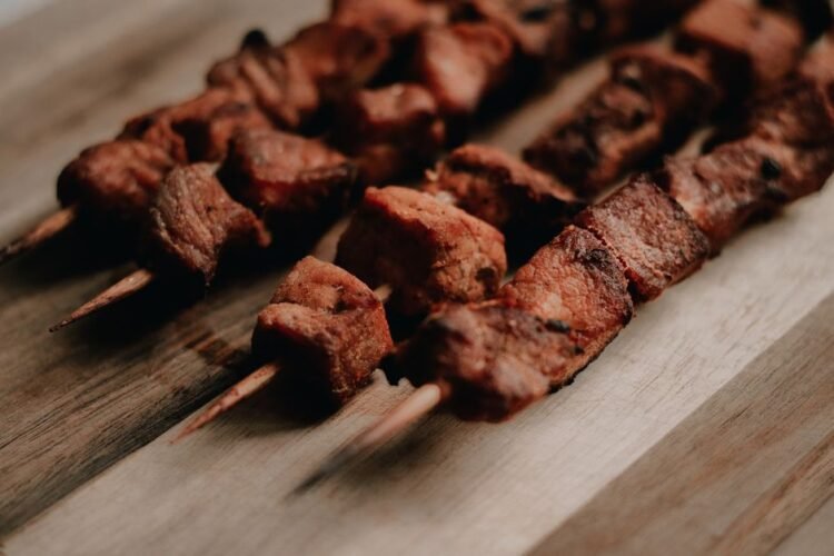 Ugandan Char-Grilled Pork Skewers with Kachumbari and Cassava Fries
