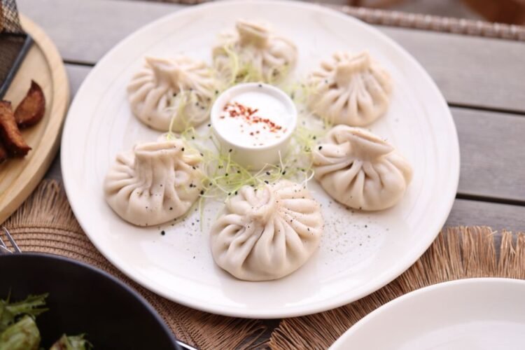Afghan Leek Dumplings with Garlic Yogurt and Spiced Meat Sauce