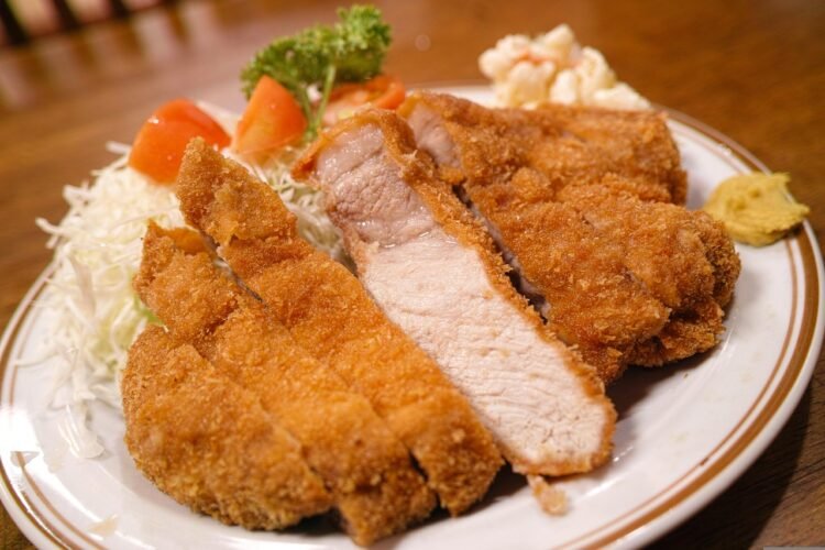 Argentine Breaded Beef Cutlets with Tomato, Ham and Mozzarella