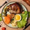 Berlin-Style Boiled Pork Knuckle with Pea Puree and Sauerkraut