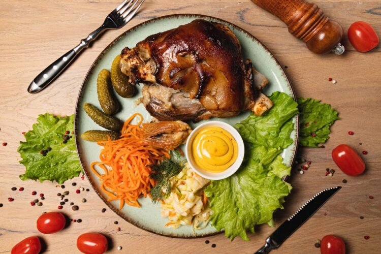 Berlin-Style Boiled Pork Knuckle with Pea Puree and Sauerkraut