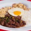 Bolivian Breaded Beef Cutlet over Rice with Fried Egg and Tomato-Onion Salsa