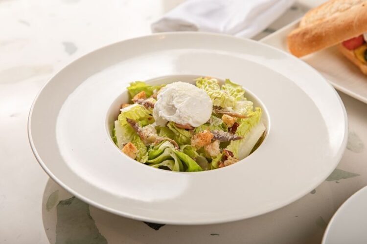 Classic French Lyonnaise Salad with Bacon and Poached Egg