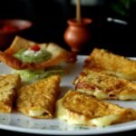 Crispy Birria and Cheese Tortillas with Chile Consomé
