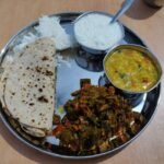 Dal Baati Churma (Rajasthani Baked Wheat Dumplings with Spiced Lentils and Sweet Crumble)