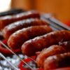 Grilled Polish Kielbasa with Caramelized Onions and Sauerkraut Slaw