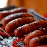 Grilled Polish Kielbasa with Caramelized Onions and Sauerkraut Slaw