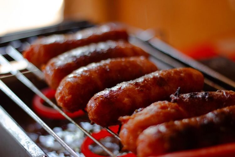 Grilled Polish Kielbasa with Caramelized Onions and Sauerkraut Slaw