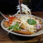 Lao Green Papaya Salad with Padaek and Smoked Catfish