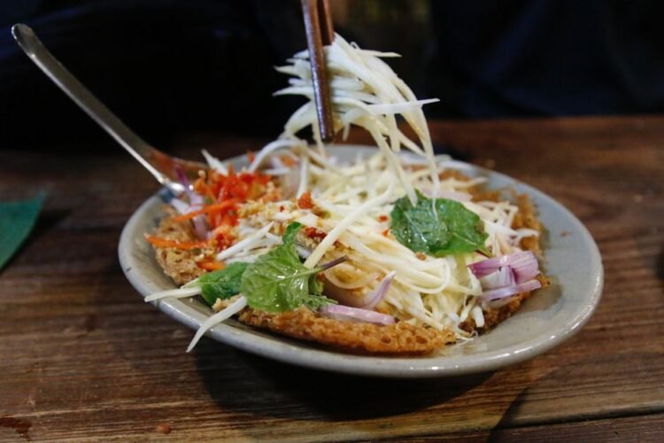 Lao Green Papaya Salad with Padaek and Smoked Catfish
