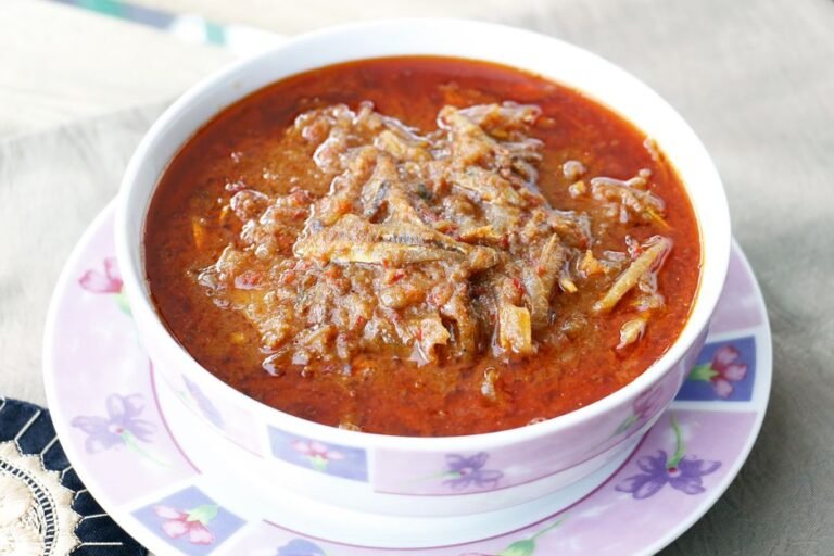 Liberian Palm Nut Soup with Smoked Fish and Greens