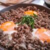 Panamanian-Style Crispy Tasajo Skillet with Eggs, Rice, and Avocado