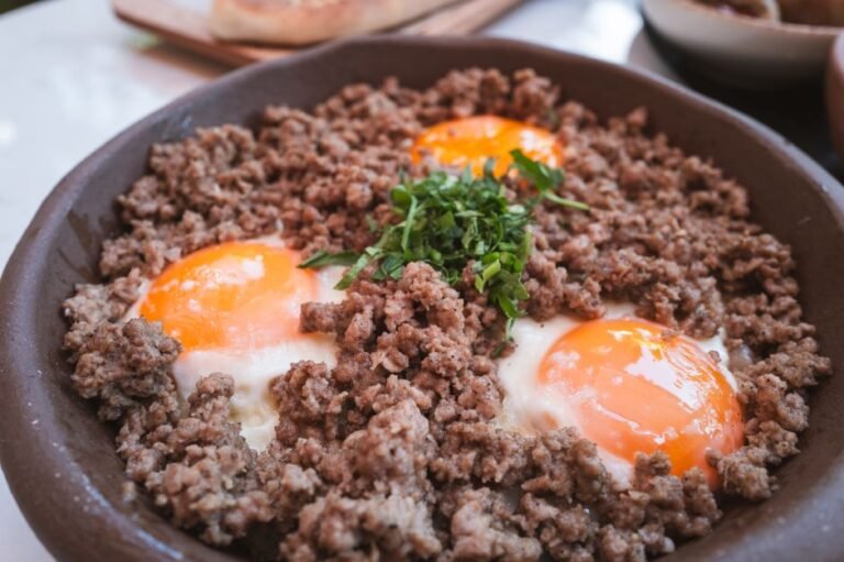 Panamanian-Style Crispy Tasajo Skillet with Eggs, Rice, and Avocado