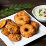 South Indian Sambar Vada (Crispy Lentil Fritters in Tamarind Stew)