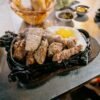 Vietnamese Steak Plate with Fried Egg and Pickled Vegetables