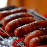 Grilled Polish Kielbasa with Caramelized Onions and Sauerkraut Slaw