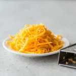 Grated sharp cheddar cheese