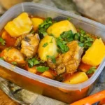 Mozambican Chicken Stew with Palm Oil and Peanuts