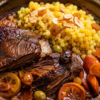 Slow-Braised Moroccan Short Ribs with Honey-Saffron Carrots and Buttery Pearl Couscous
