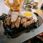 Vietnamese Steak Plate with Fried Egg and Pickled Vegetables