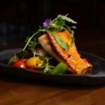 Panamanian-Style Baked Corvina with Bell Pepper and Tomato Sauce