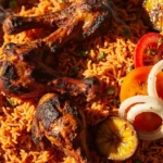 Party-style jollof rice with grilled chicken and plantain